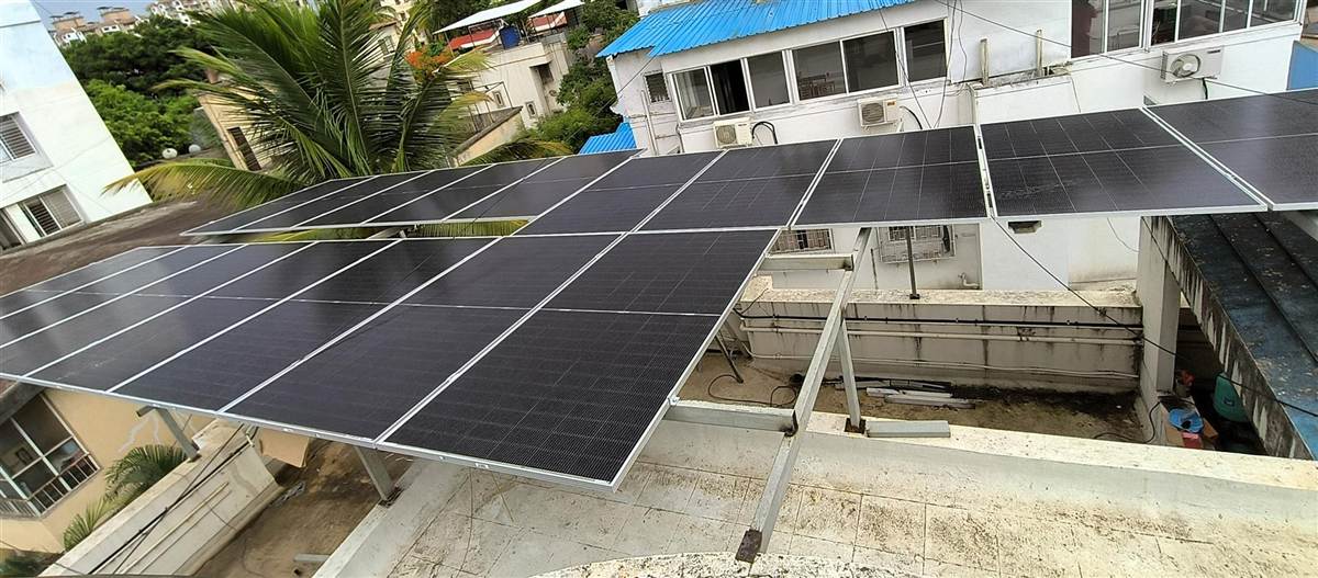 A rooftop solar panel mounting structure holding multiple solar panels.